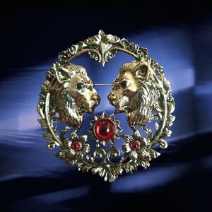 Gold-Tone Lion Motif Brooch with Red Cabochons